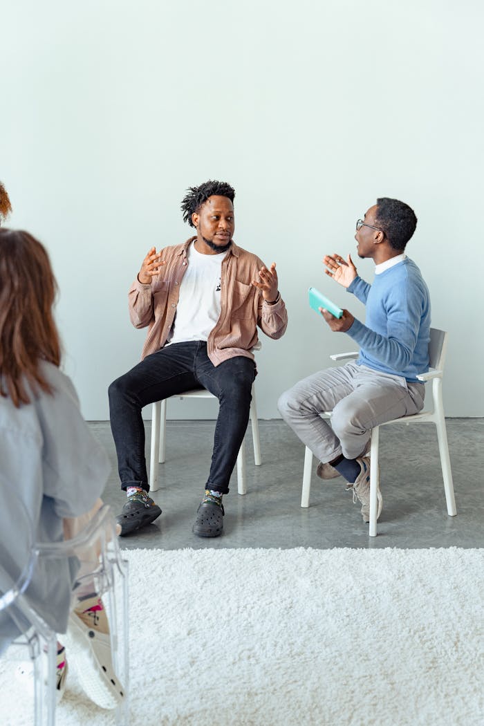 Therapist and client in a dynamic discussion during a therapy session with a focus on mental health.